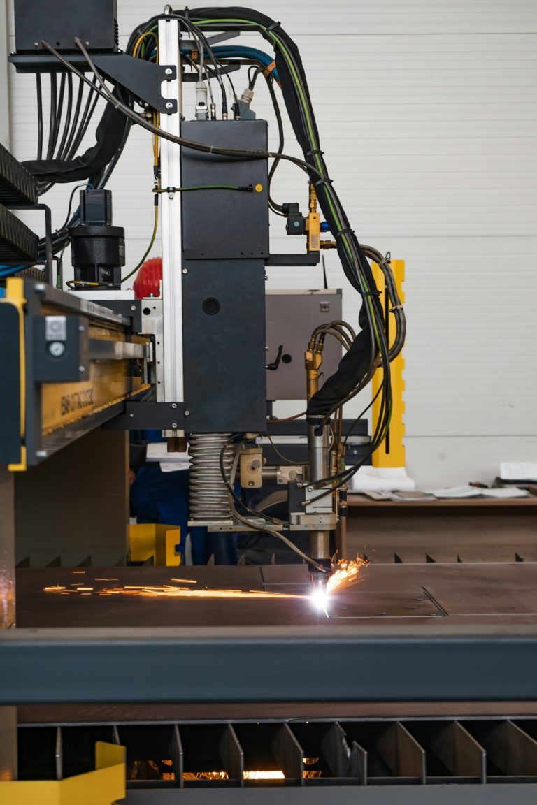 Vertical shot of metal plasma cutting in a factory